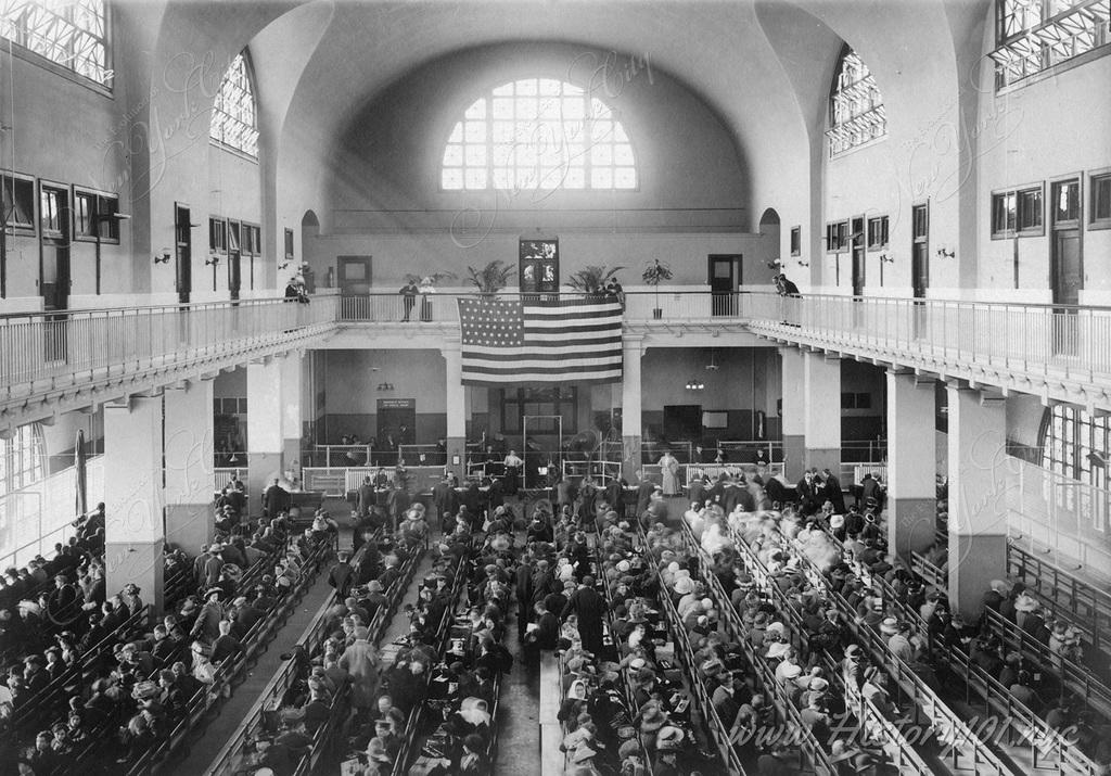 Immigrants waiting inside the Great Hall on Ellis Island